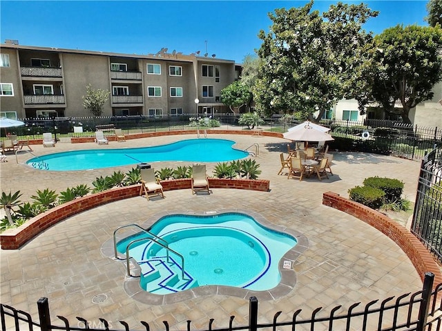 view of pool featuring a patio area