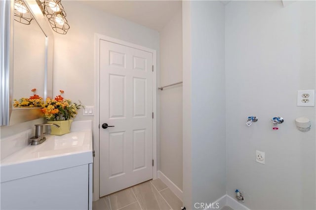 bathroom with vanity and tile patterned flooring