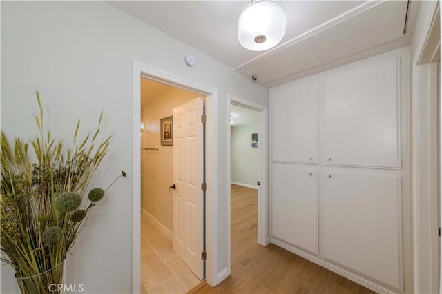 hallway with light wood-type flooring