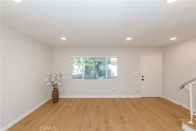 spare room featuring light hardwood / wood-style flooring