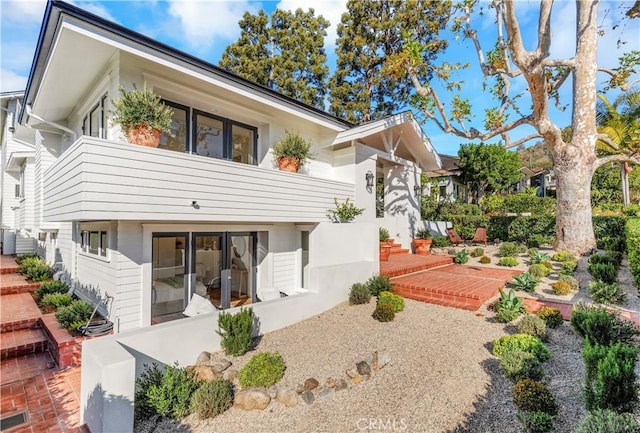 rear view of house featuring a patio