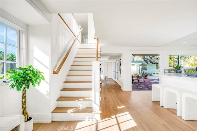 staircase featuring wood-type flooring