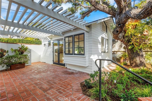 view of patio with french doors and a pergola