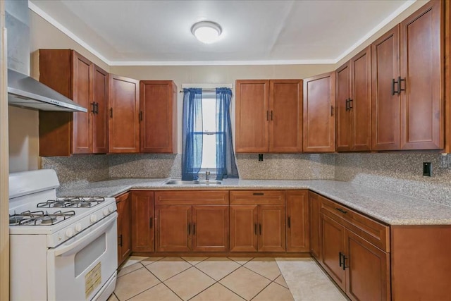 kitchen with wall chimney range hood, sink, light tile patterned floors, gas range gas stove, and backsplash