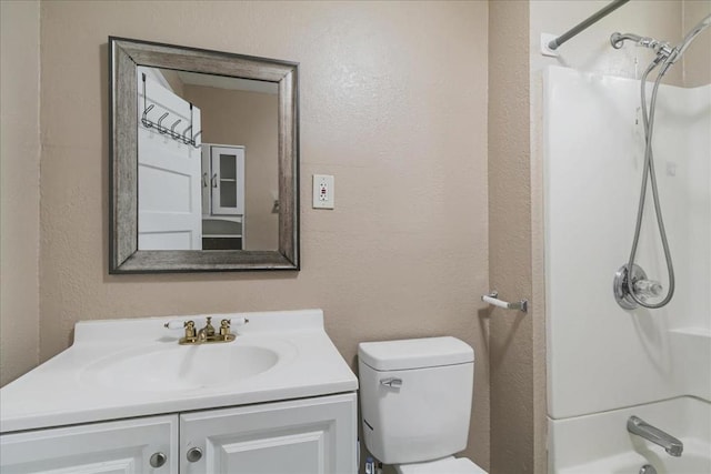 full bathroom with vanity,  shower combination, and toilet