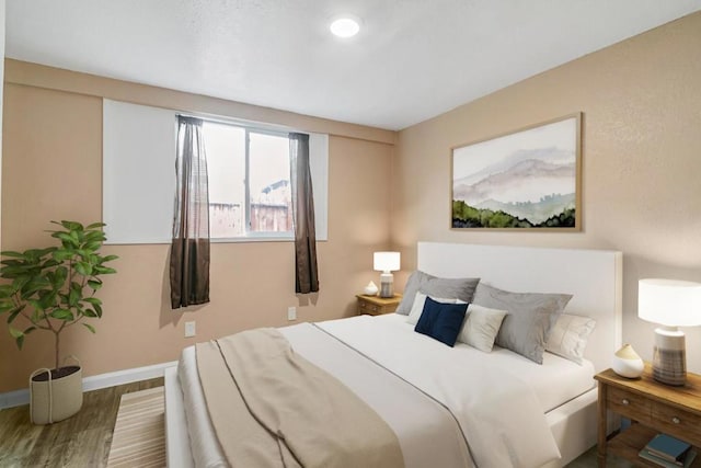 bedroom featuring wood-type flooring