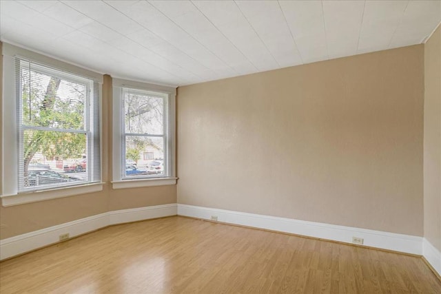 spare room with light hardwood / wood-style floors