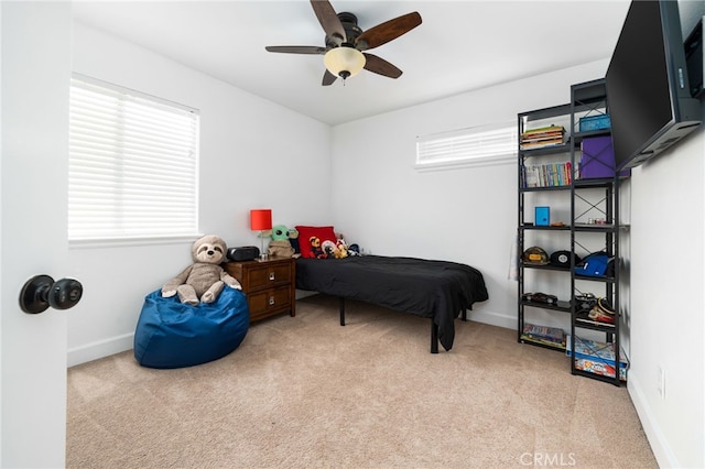 carpeted bedroom featuring ceiling fan