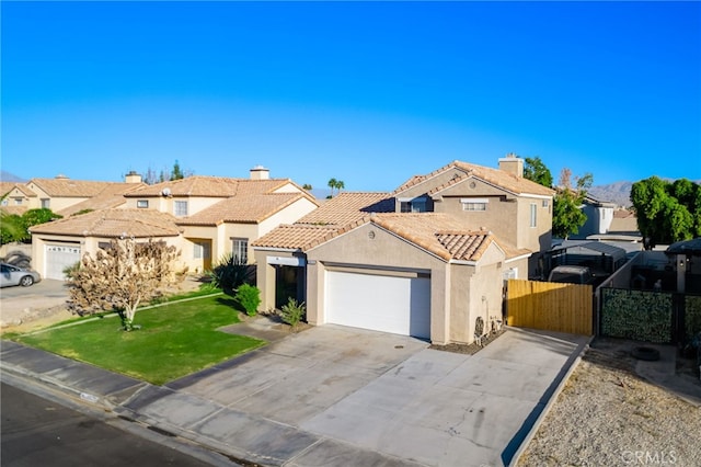 view of front of property with a front yard and a garage