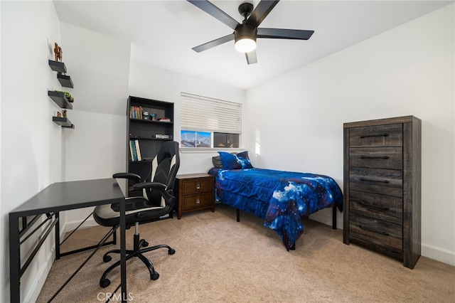 bedroom featuring light carpet and ceiling fan