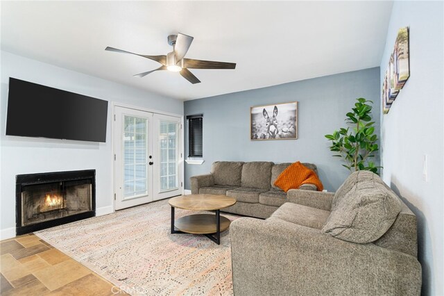 living room with ceiling fan and french doors