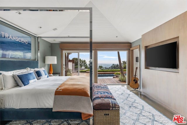 bedroom with wood-type flooring, lofted ceiling, and access to outside