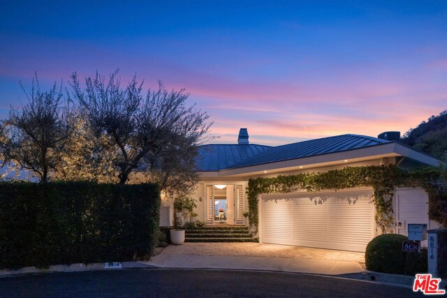 view of front of property with a garage