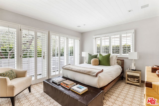 bedroom featuring access to outside and wood ceiling