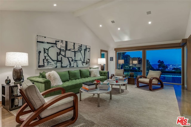 living room featuring beam ceiling, light hardwood / wood-style floors, and high vaulted ceiling