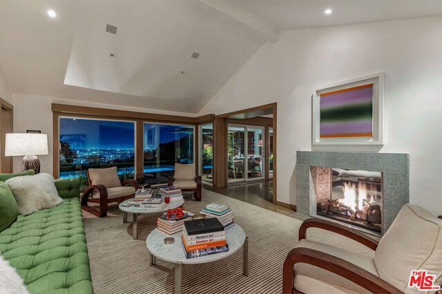 living room featuring vaulted ceiling with beams