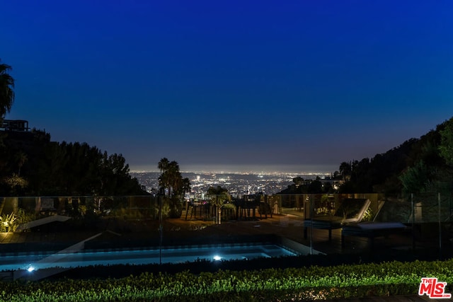 view of swimming pool featuring a jacuzzi