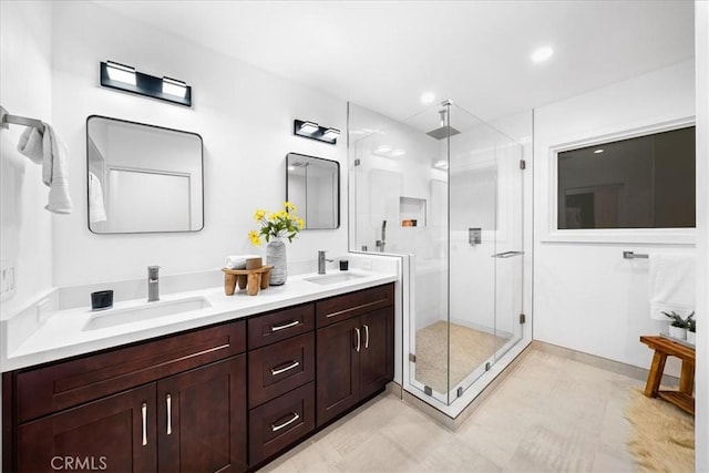 bathroom featuring vanity and walk in shower