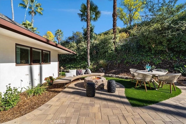 view of patio / terrace with a fire pit