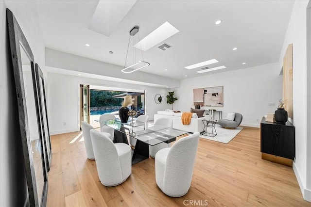 dining space featuring light wood-type flooring