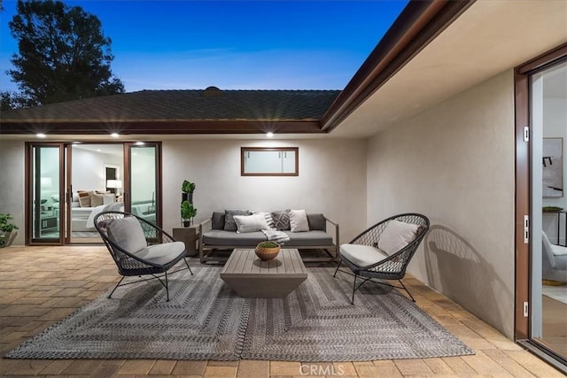 patio terrace at dusk with an outdoor living space