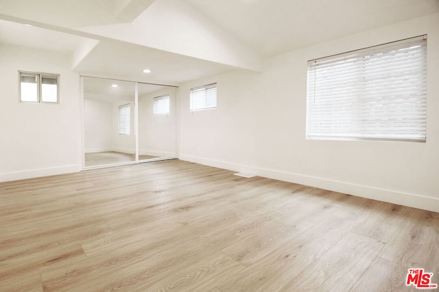 basement featuring light wood-type flooring