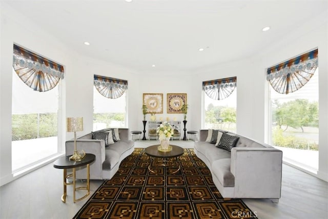 living room with ornamental molding