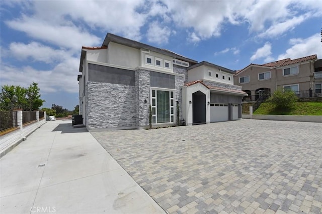 mediterranean / spanish-style house featuring a garage