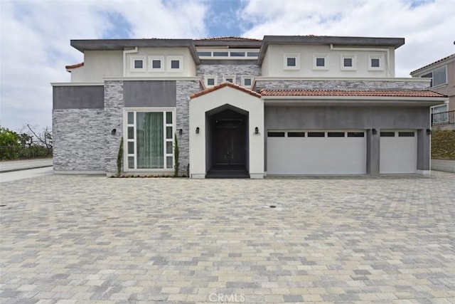 view of front of home with a garage