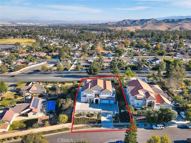 birds eye view of property with a mountain view