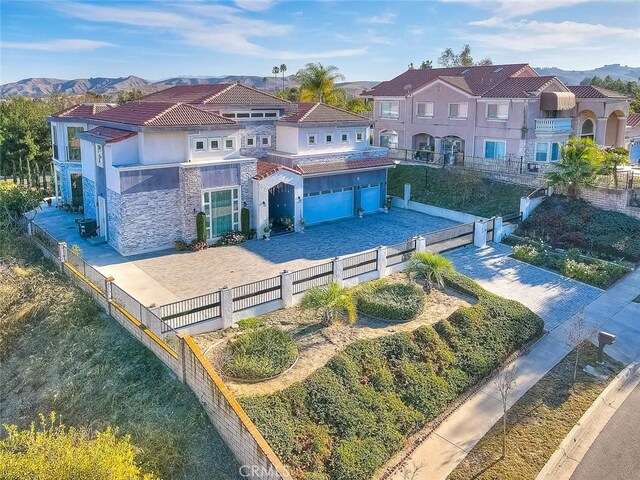 birds eye view of property featuring a mountain view