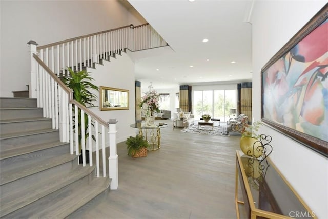 staircase featuring wood-type flooring