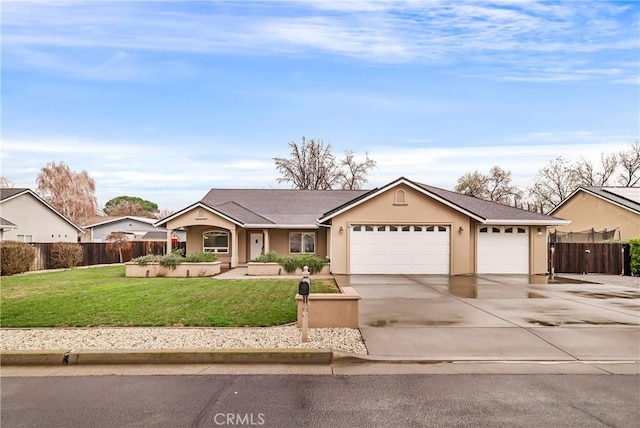 ranch-style home featuring a garage and a front lawn