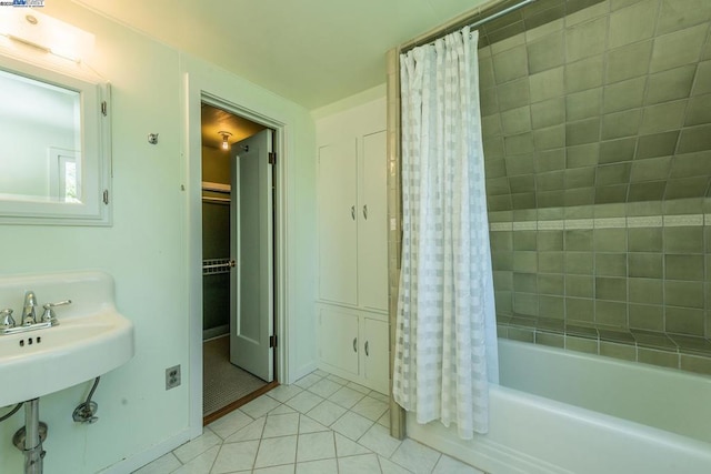 bathroom with tile patterned floors and shower / bath combo