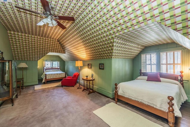 carpeted bedroom featuring vaulted ceiling, ceiling fan, and multiple windows