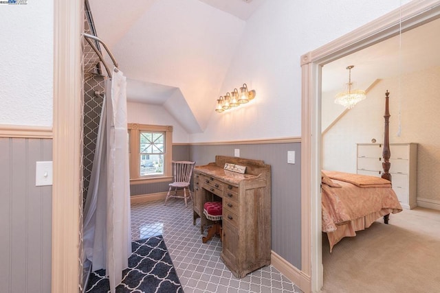 bathroom featuring lofted ceiling