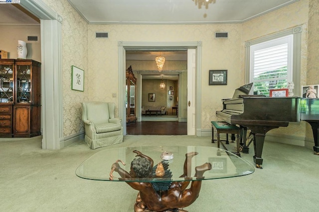 living area featuring crown molding and carpet flooring