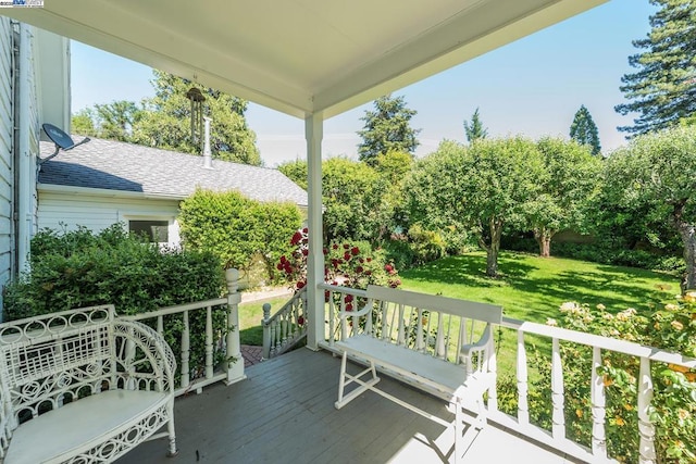 exterior space featuring a lawn and a porch