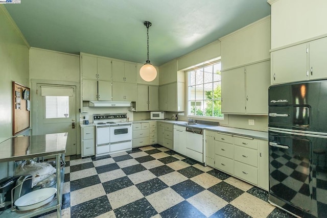 kitchen with decorative light fixtures, sink, and white appliances