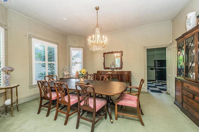 dining space featuring light carpet, a notable chandelier, and crown molding