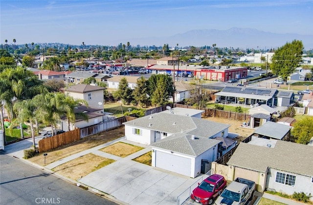 birds eye view of property with a mountain view