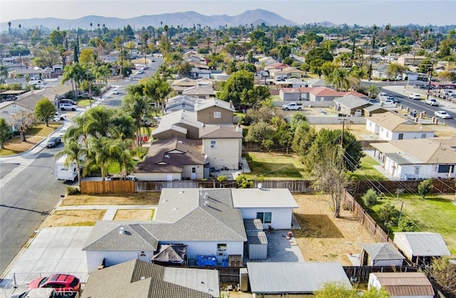 birds eye view of property featuring a mountain view