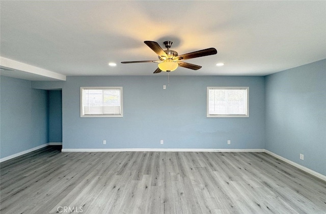 spare room with ceiling fan and light hardwood / wood-style floors