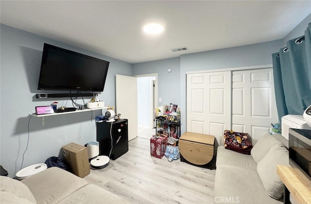 living room with light hardwood / wood-style floors