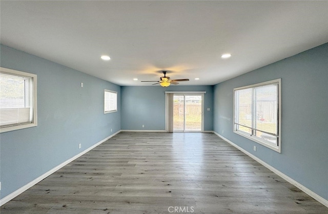 empty room featuring ceiling fan and light hardwood / wood-style flooring