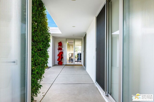 hallway featuring a skylight