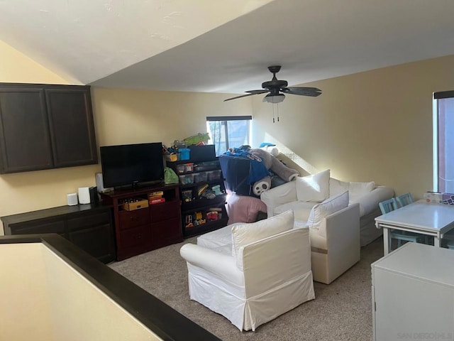 carpeted living room featuring ceiling fan