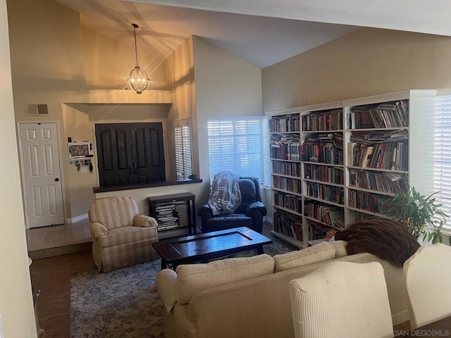 living room featuring vaulted ceiling and plenty of natural light