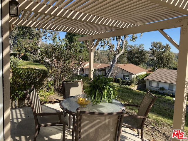 view of patio featuring a pergola