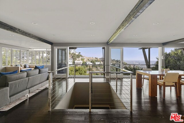 sunroom / solarium with a wealth of natural light and beamed ceiling